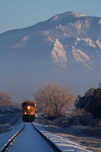 united states train near mountain range boulder